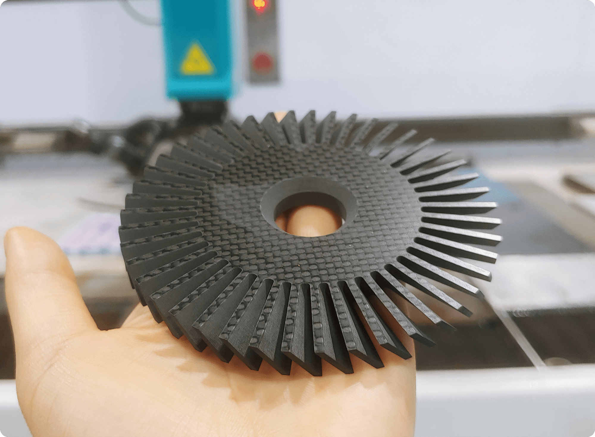 hand holding a composite impeller